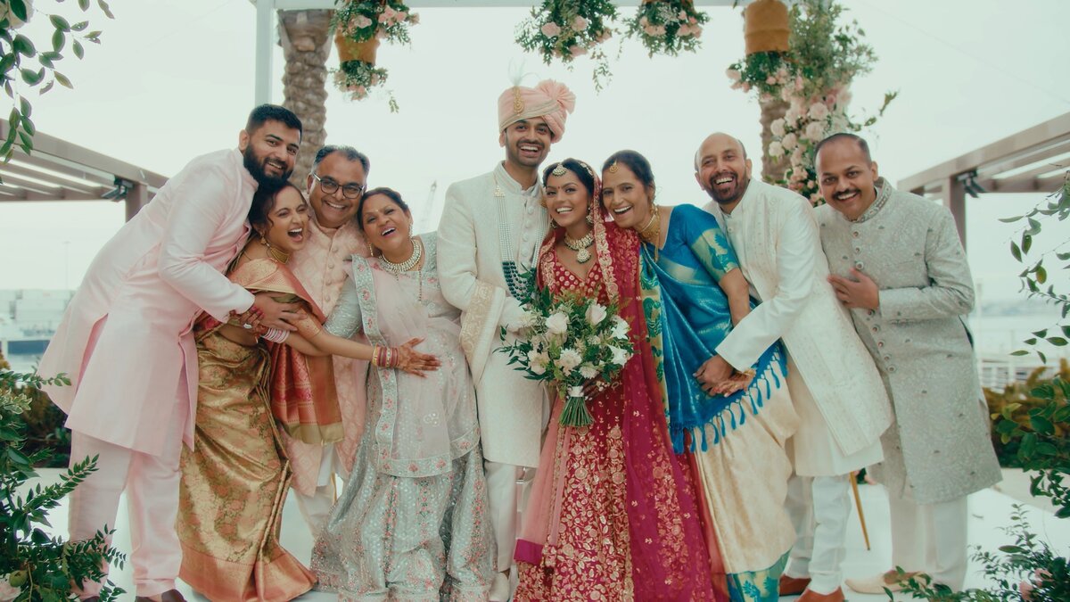 Indian wedding couple with guests