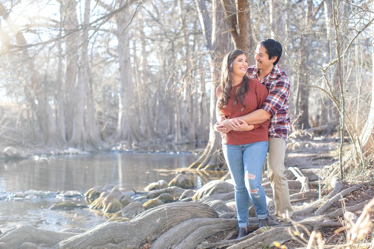 winter wedding engagement session plaid shirt orange sweater at Cibolo Nature Center in Boerne Texas  by Firefly Photography