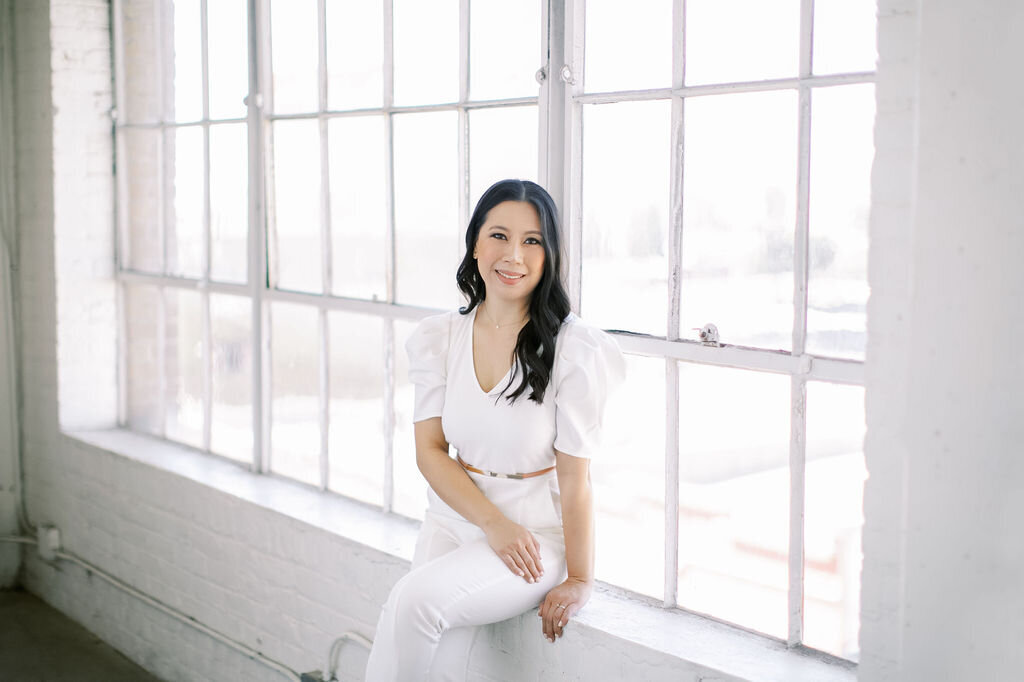 Image of professional sitting by window