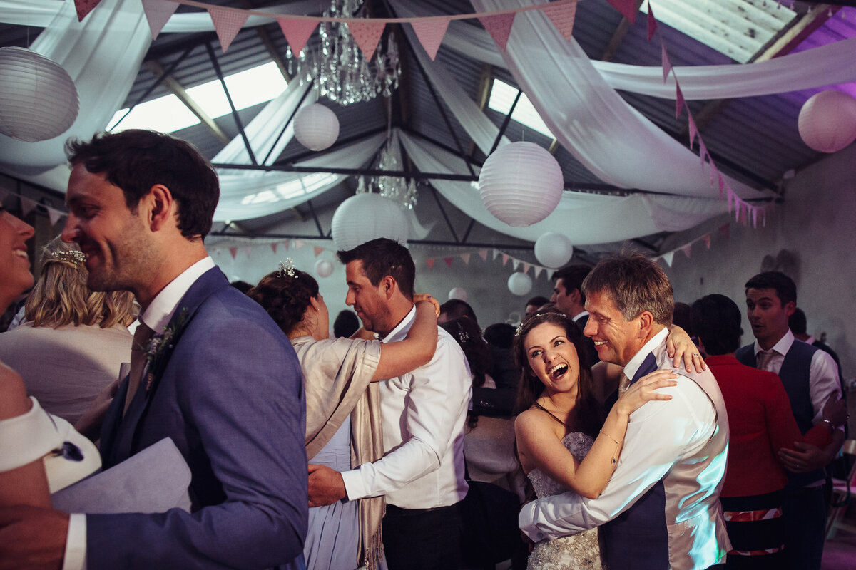 Dad and daughter dance at barn wedding