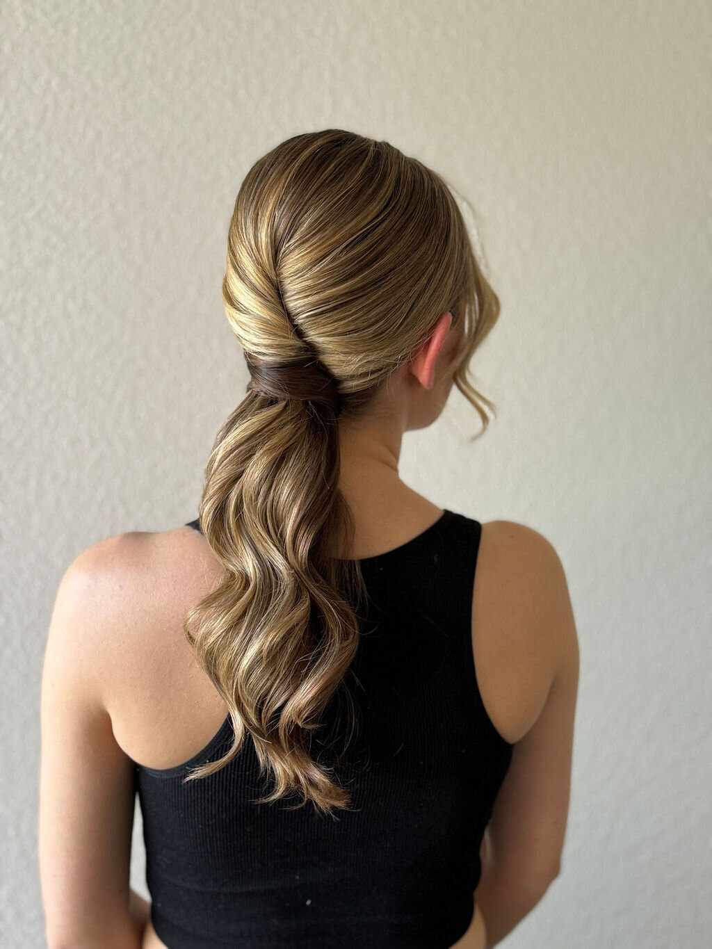  Elegant low ponytail hair style and glowing soft-glam makeup on a modern bride styled by Yana’s Beauty Studio for a San Francisco wedding.
