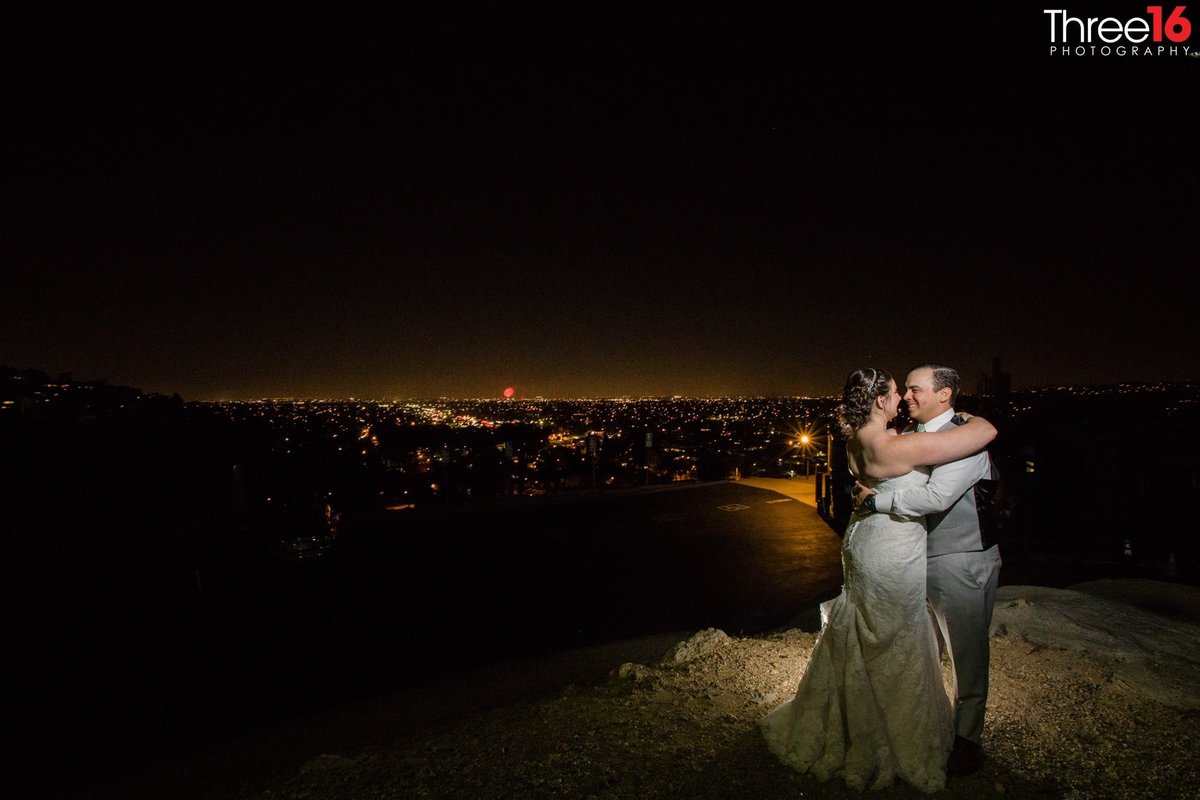 Night photo of Bride and Groom embracing each other