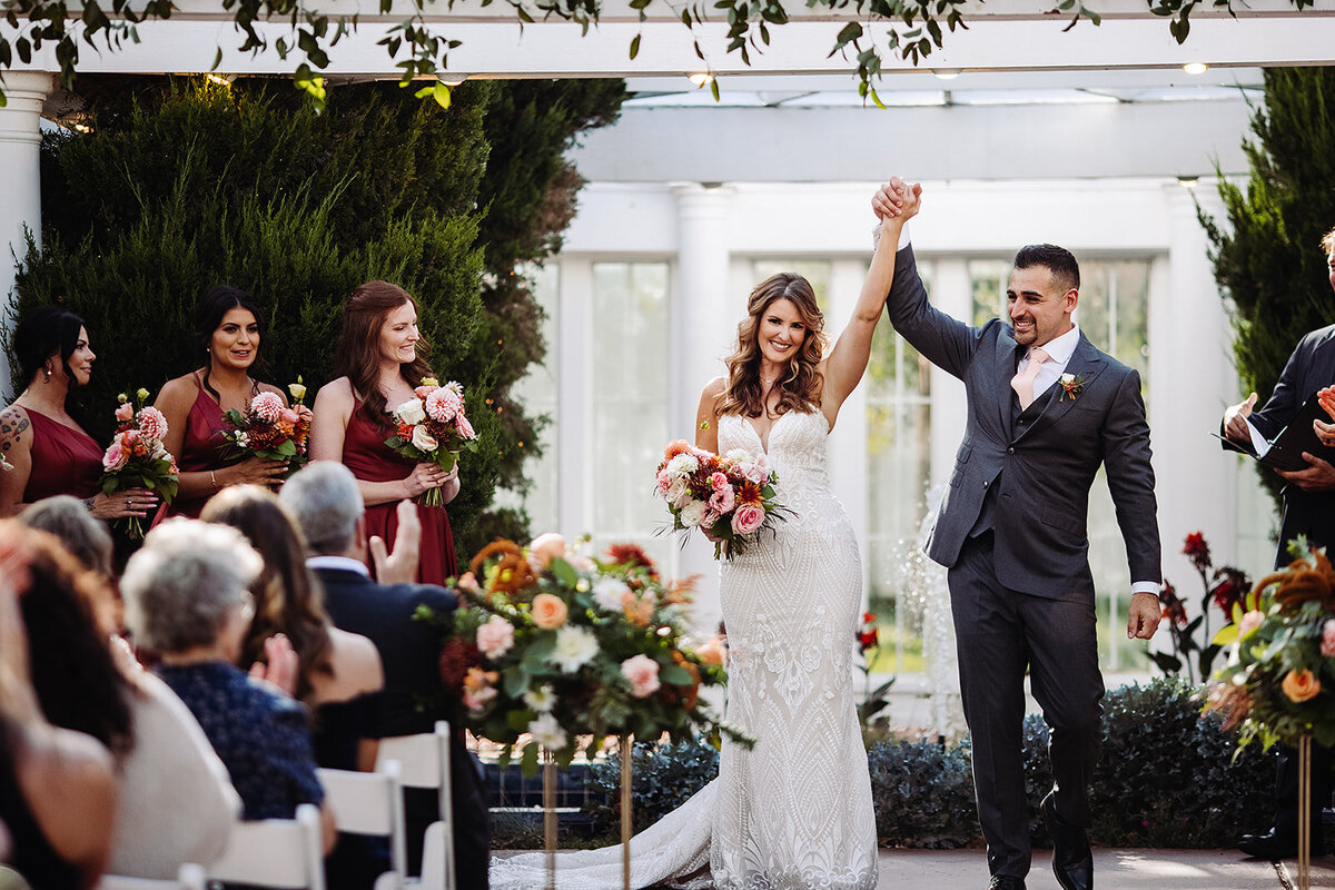 Bride and groom celebrate  after their wedding ceremony at Lionsgate Event Center.