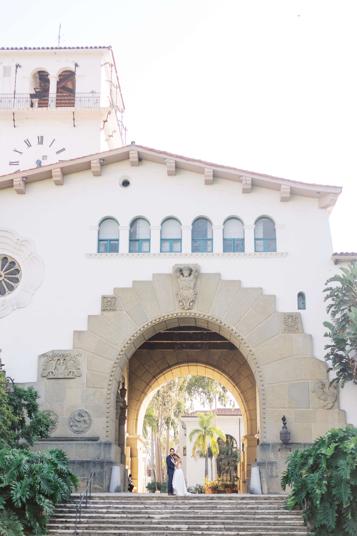 A wide shot of wedding couple at the Santa Barbara courthouse.