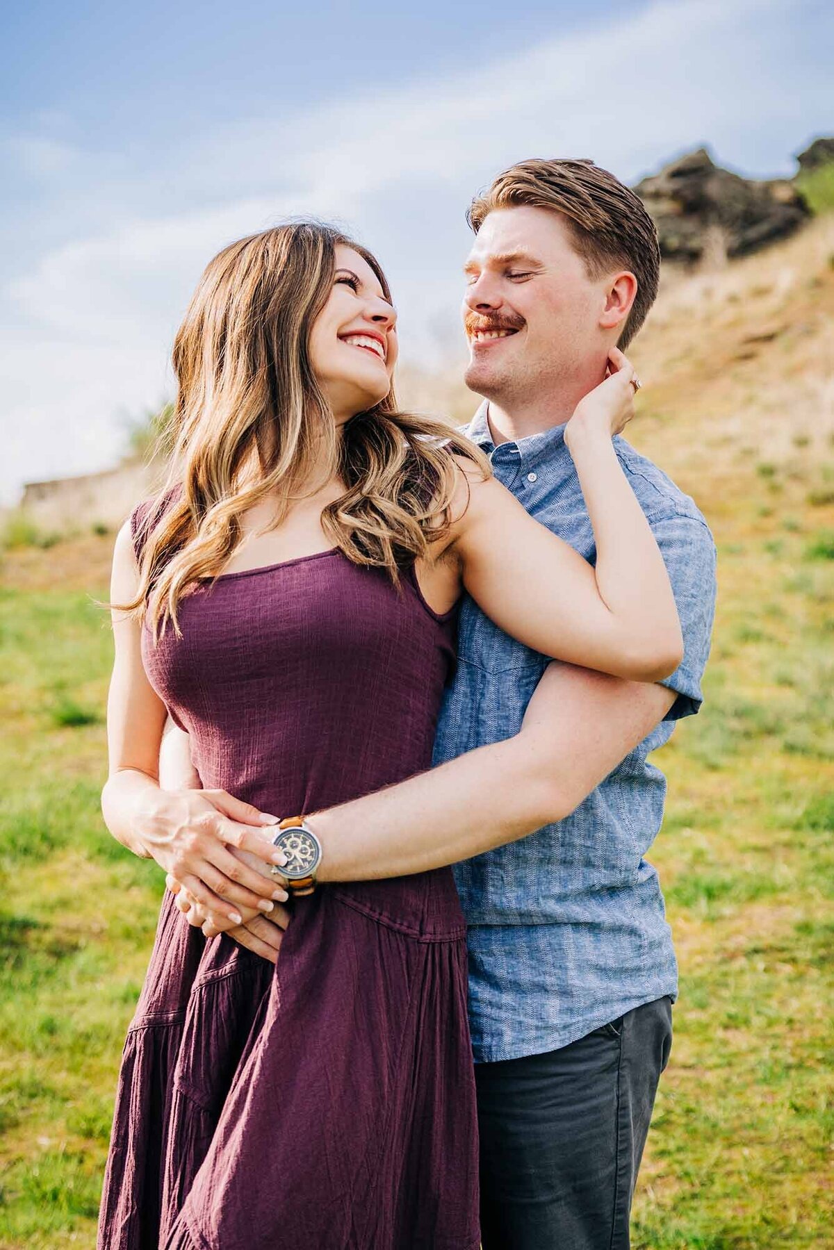 Missoula couple embracing outside on spring day