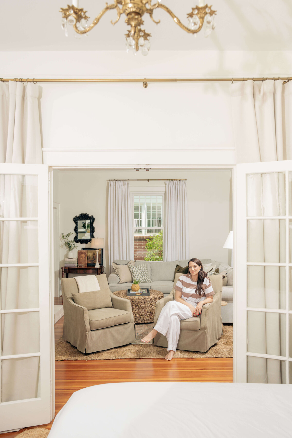 Greenville, South Carolina commercial photography featuring subject sitting in her designed space