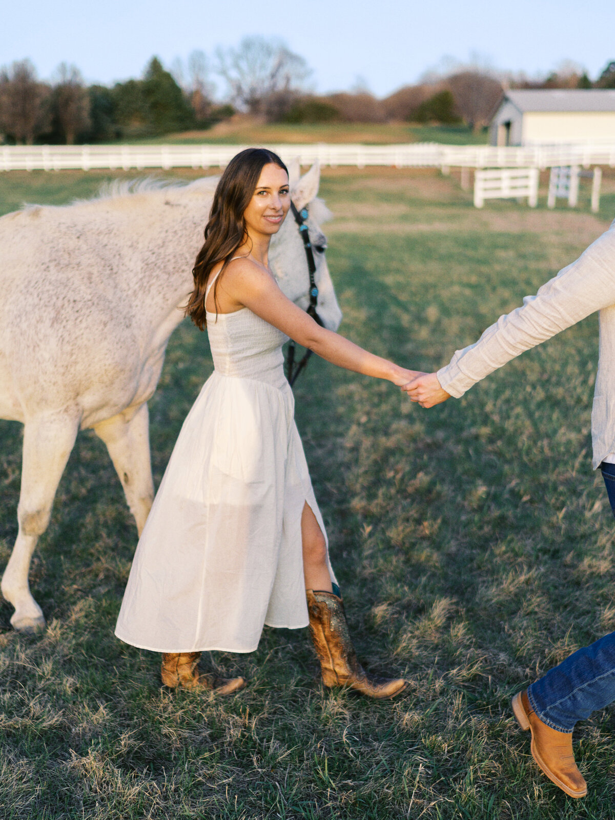 woman-smiling-with-horse-white-dress