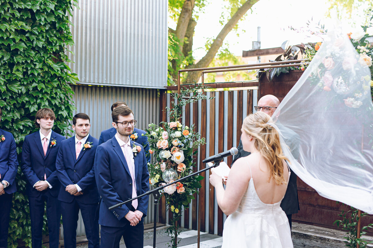 A bride reads her vows to her partner at The Joinery in Chicago