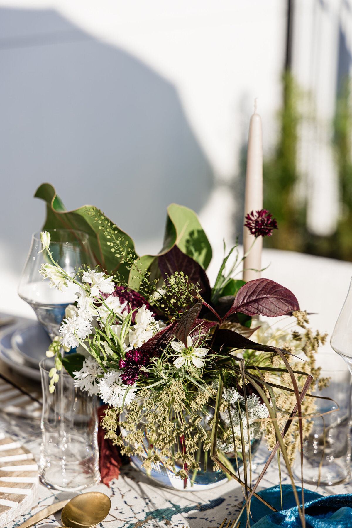 sea grape centerpiece with taper beige candle 