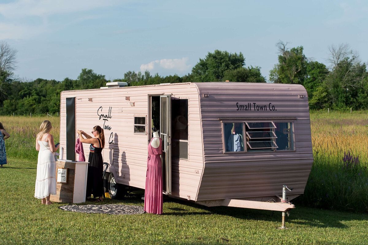 Ottawa event photos of a clothing vendor in her mobile store at Soiree in the Field.  Captured by JEMMAN Photography COMMERCIAL