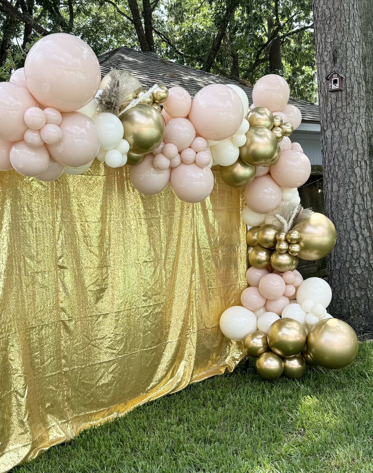 gold pink balloons and backdrop Stand Out Balloons