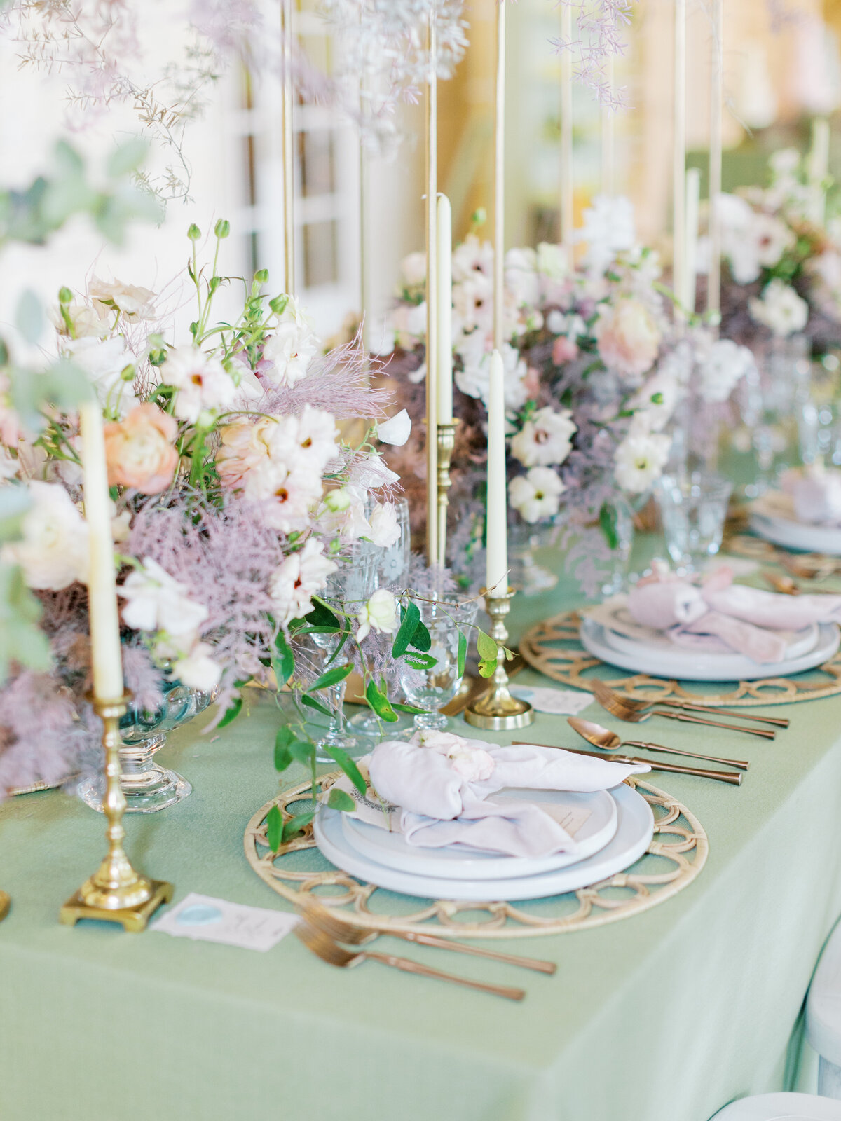 reception tablescape details with purple florals and green tablecloth 