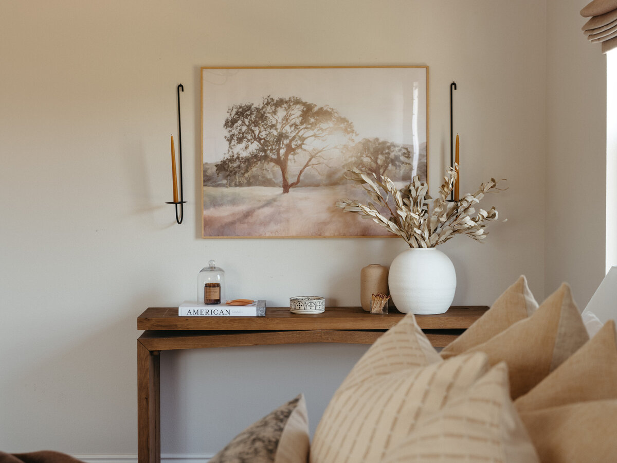 Natalie Barnas standing by bedroom dresser she styled.