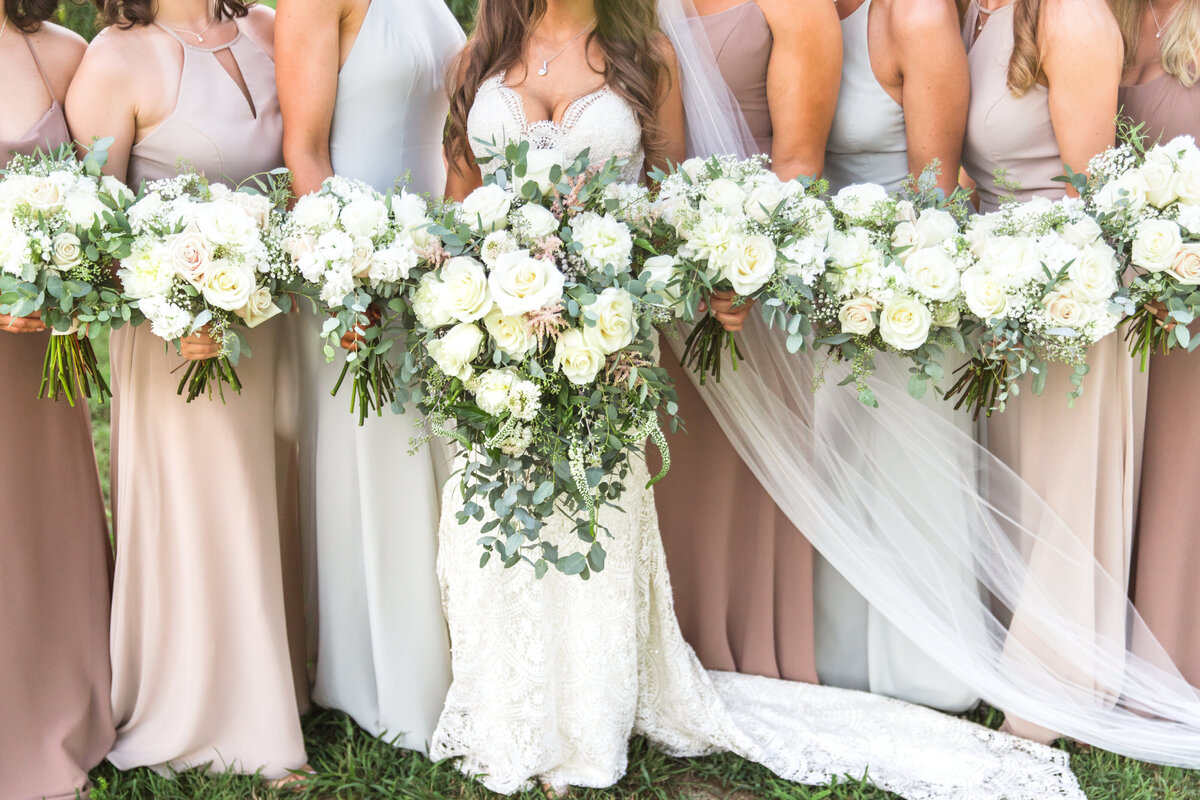 A Group of bridesmaids hold their wedding day flowers