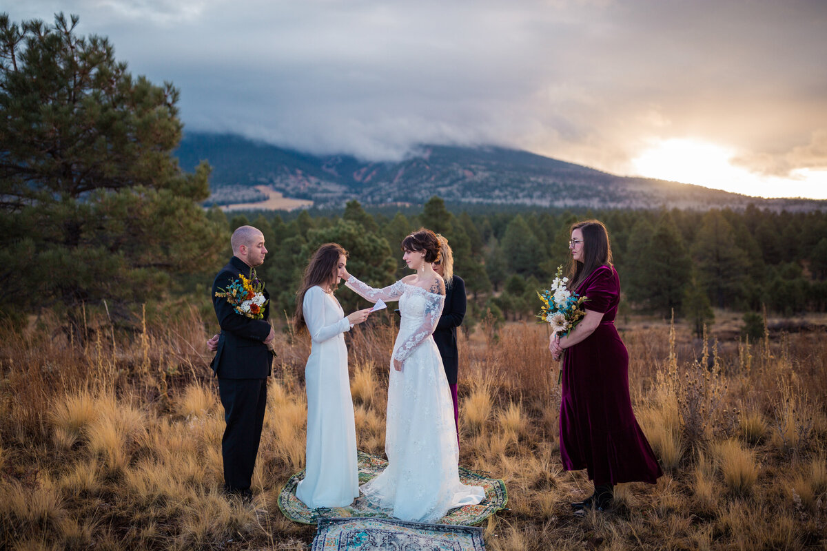 two brides embracing each other during an elopement ceremony