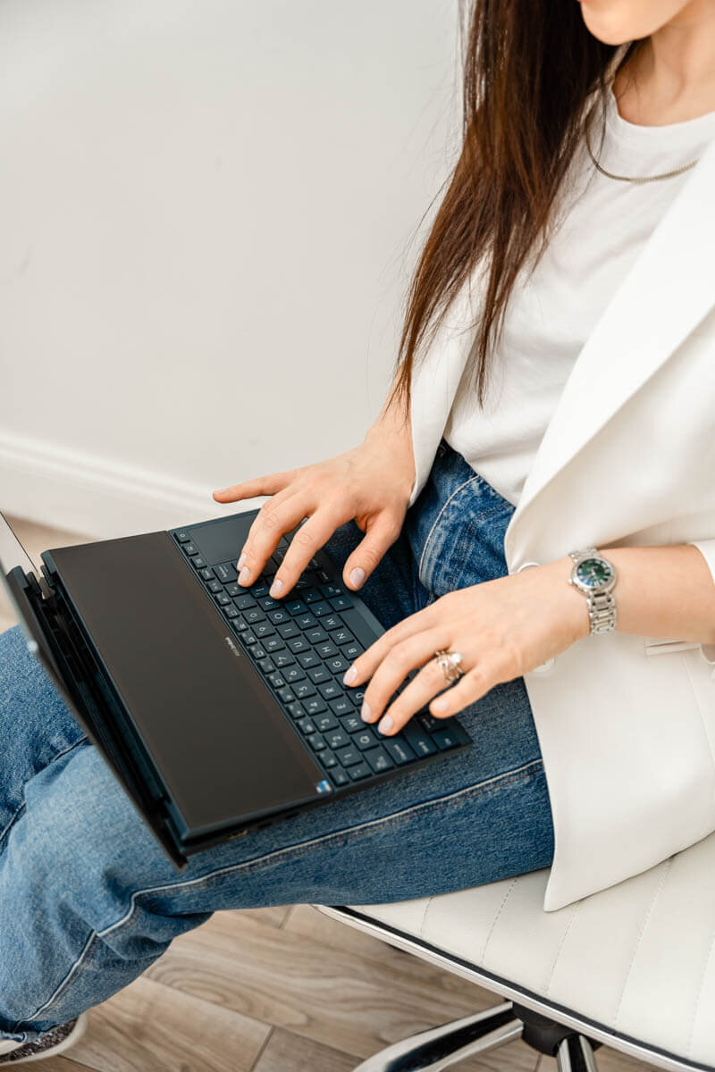 action shot of a business coach with laptop in baltimore studio
