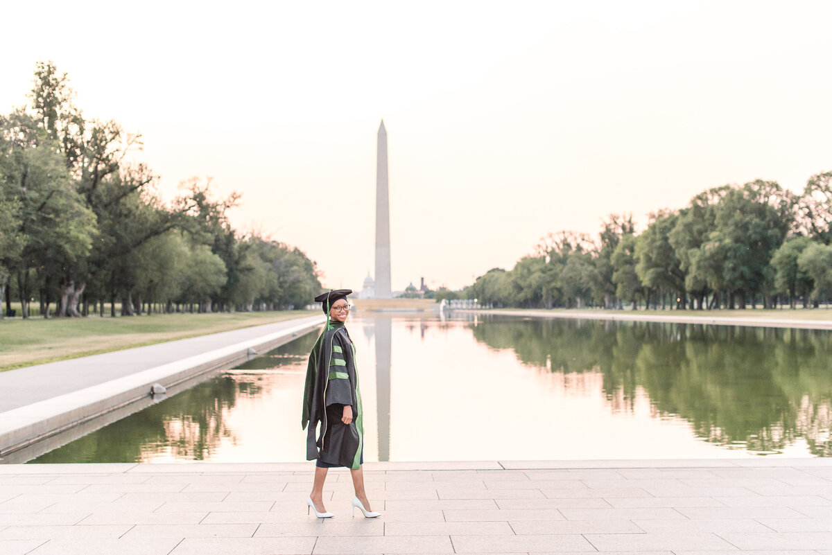 med student grad walking across reflecting pool in dc the