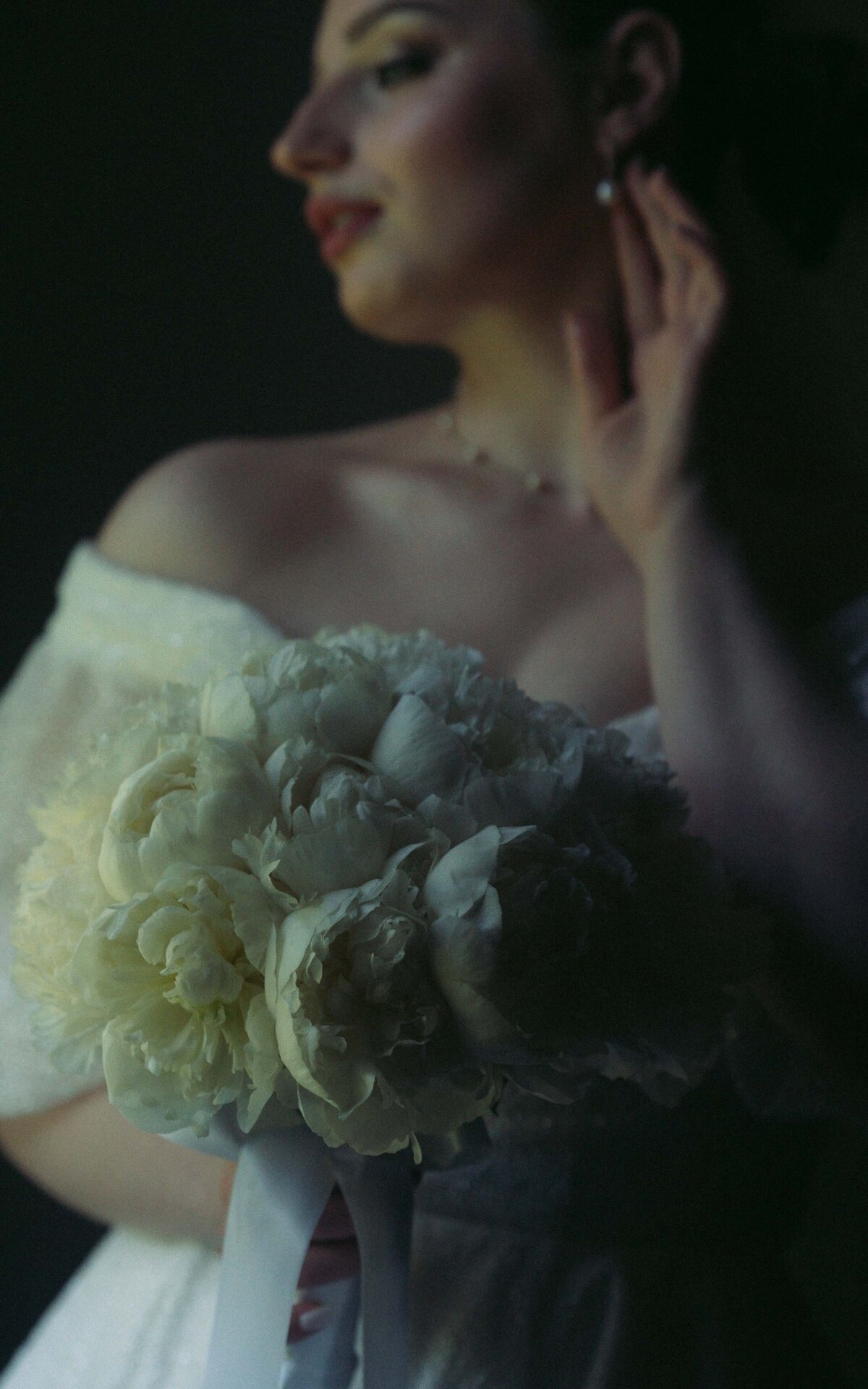 Capturing the beauty and excitement of a bride preparing for her big day, from makeup to putting on the dress.