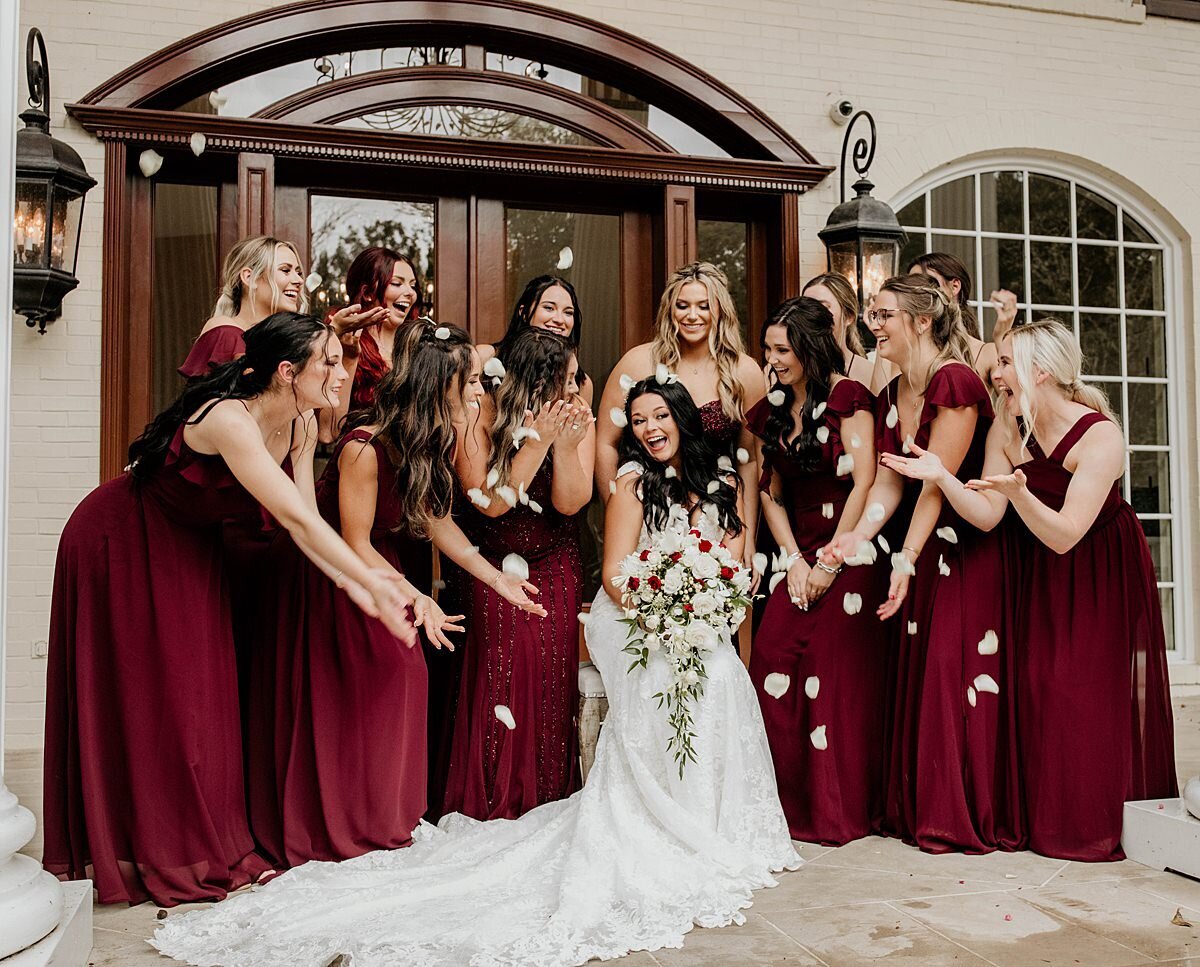 bridesmaids in dark red with bride at Cherokee Dock Mansion