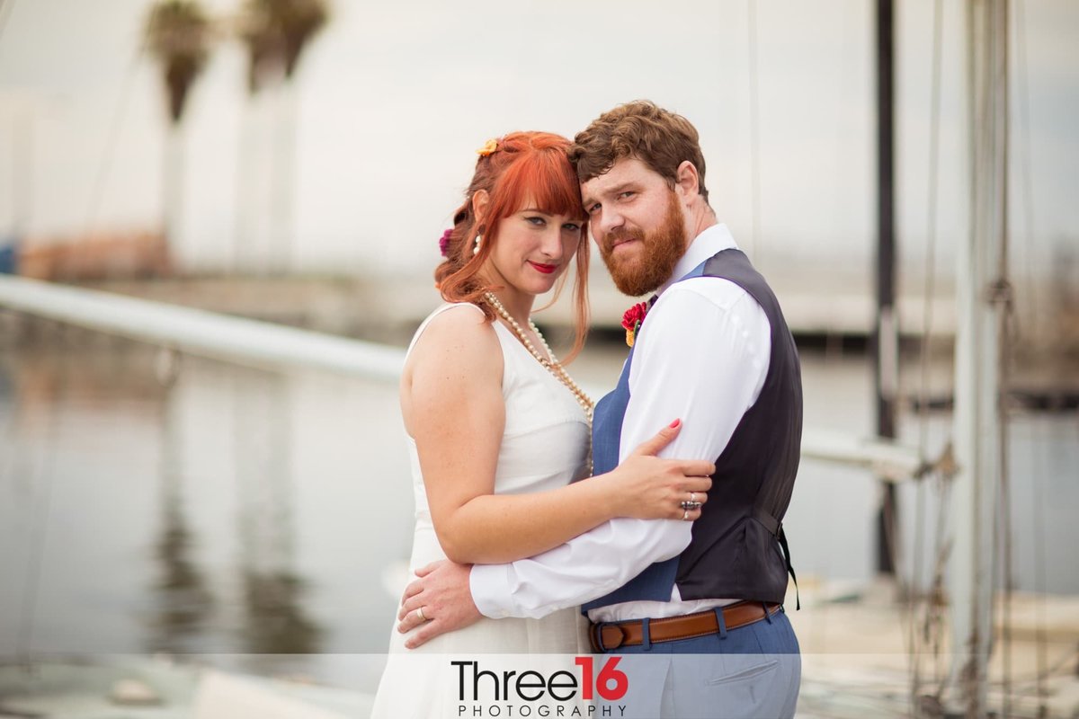 Bride and Groom pose for the wedding photographer