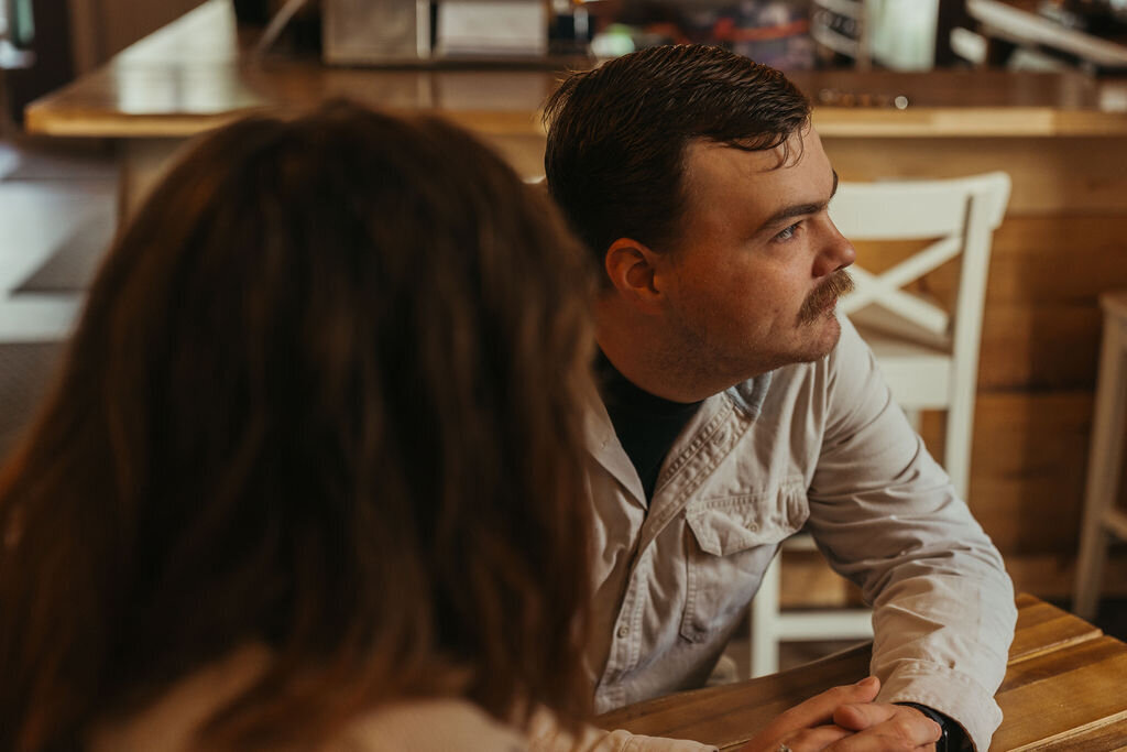 Photo from perspective of woman looking at man