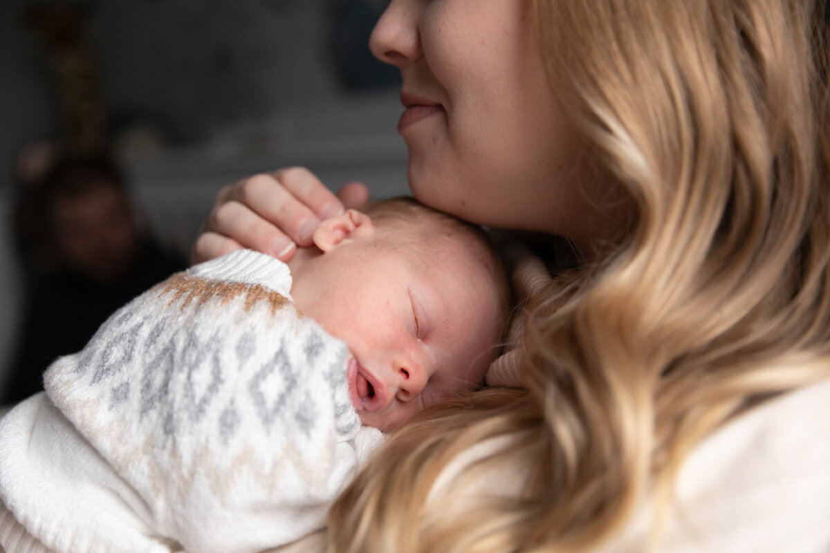 mom-snuggle-newborn-sleeping