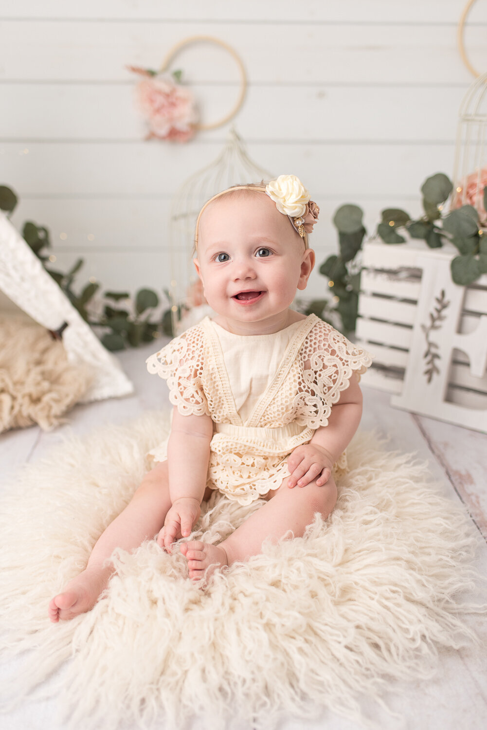 Smiling baby girl at her light and bright cake smash for first birthday |Sharon Leger Photography || Canton, CT || Family & Newborn Photographer