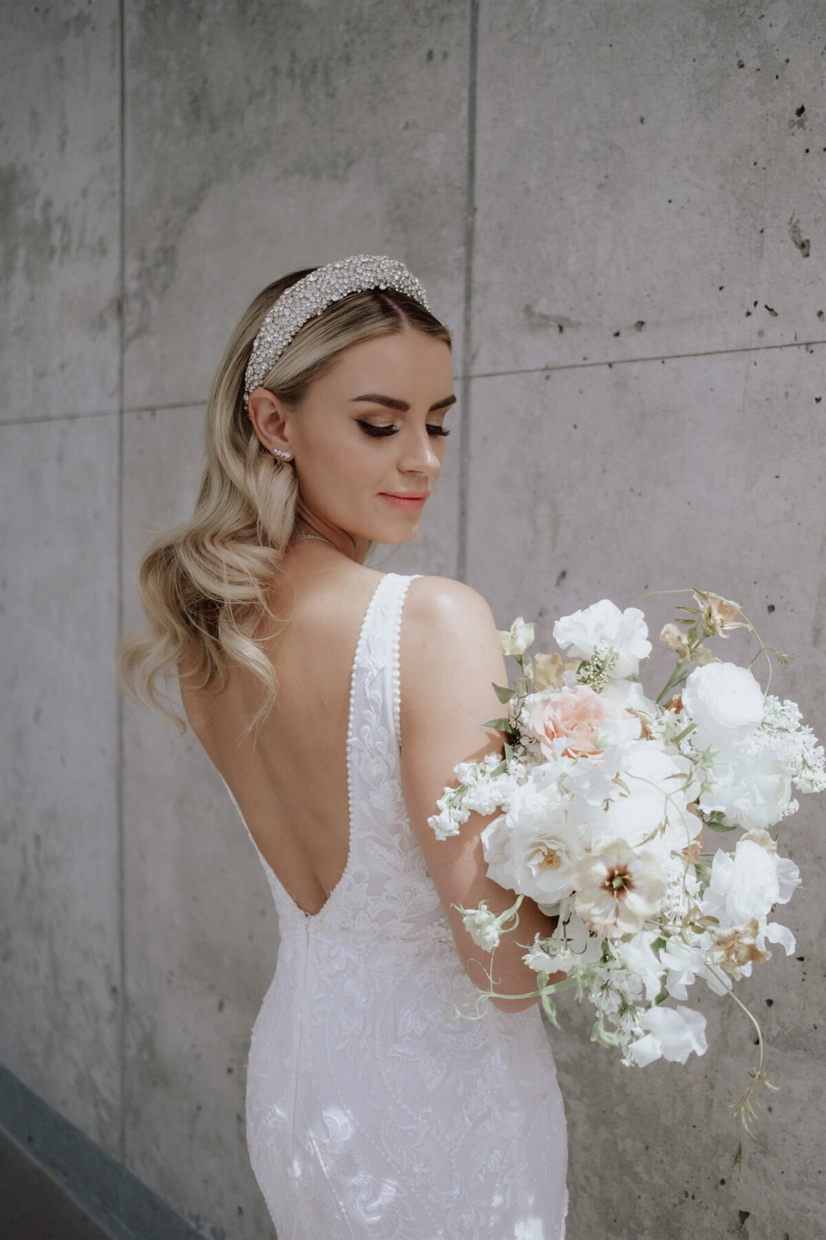 Stunning  bridal portrait featuring white florals, pearl encrusted bridal headband, styled by CNC Event Design, modern and elegant wedding planner based in Calgary, Alberta. Featured on the Brontë Bride Vendor Guide.