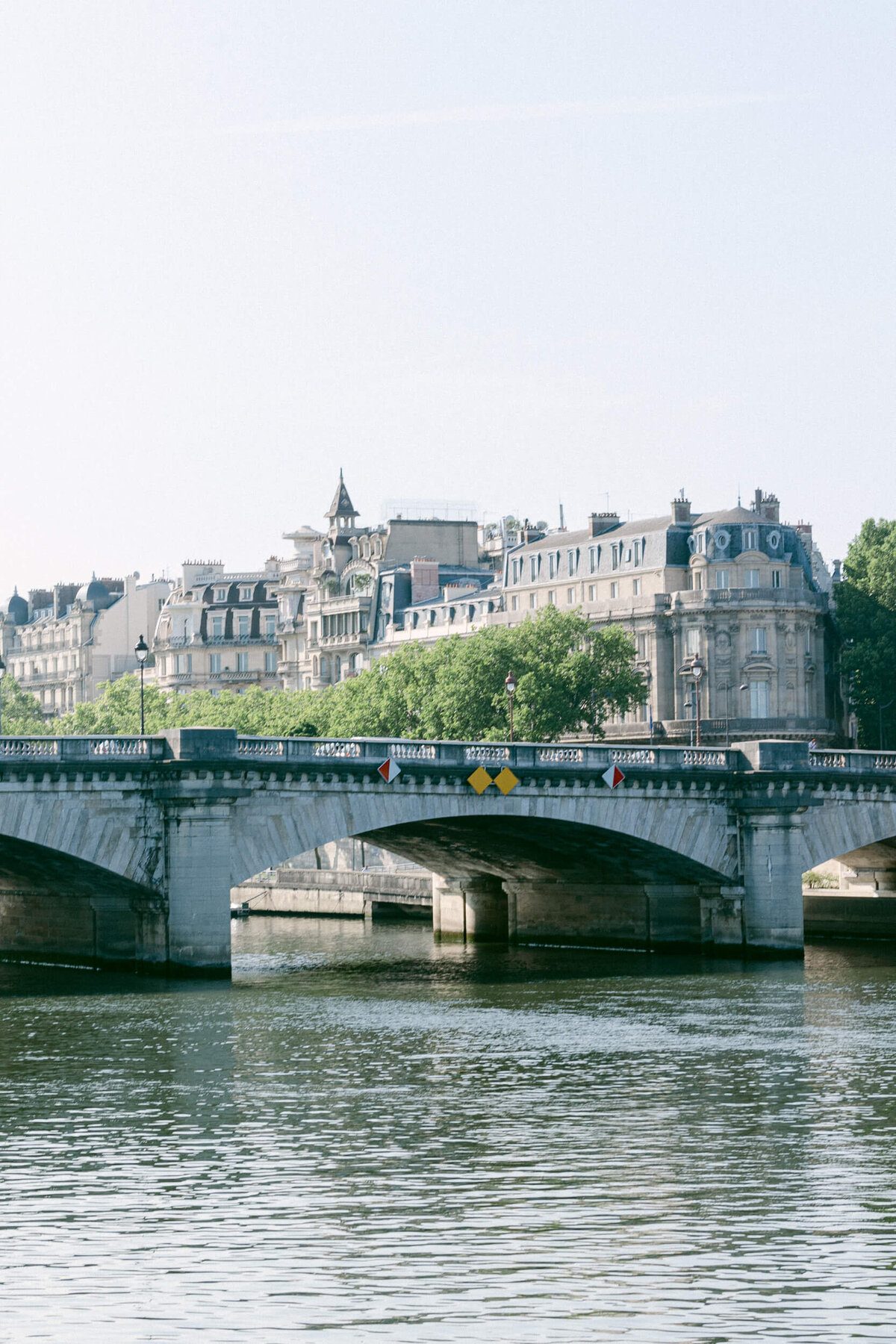 A wedding photo showing off the architecture of Paris