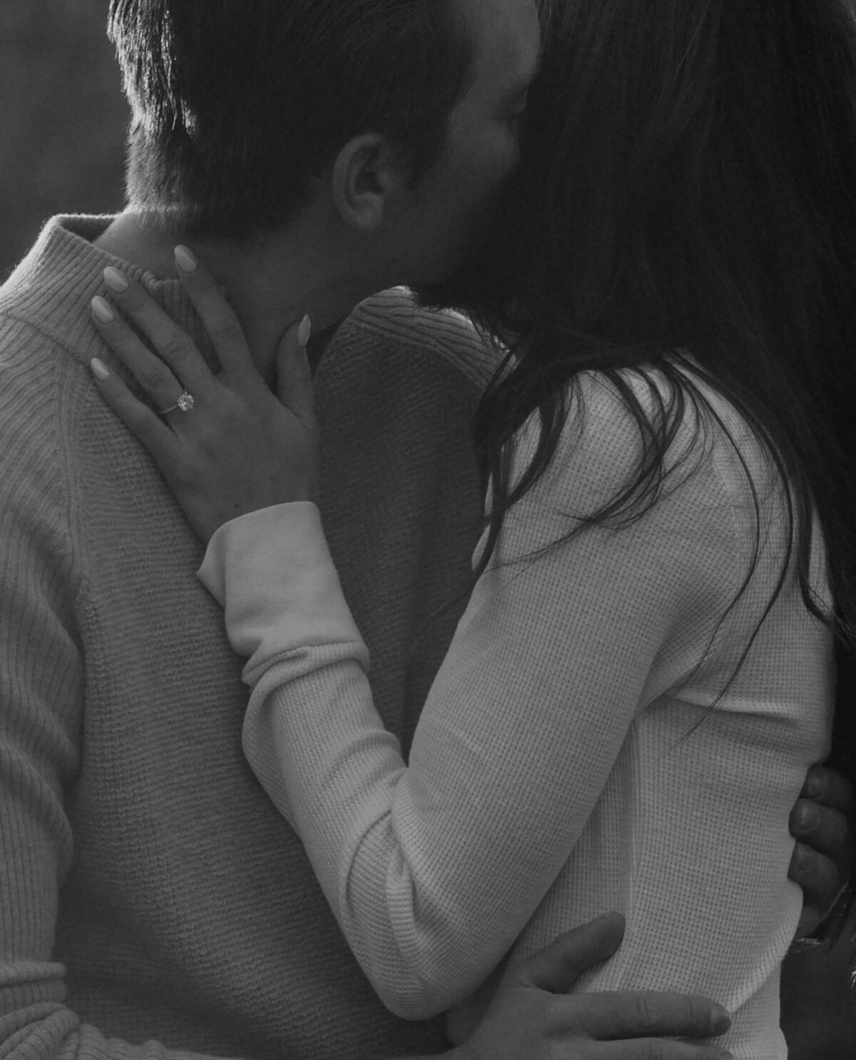 engaged couple sharing an intimate moment and kissing during an outdoor photoshoot in Bend, Oregon