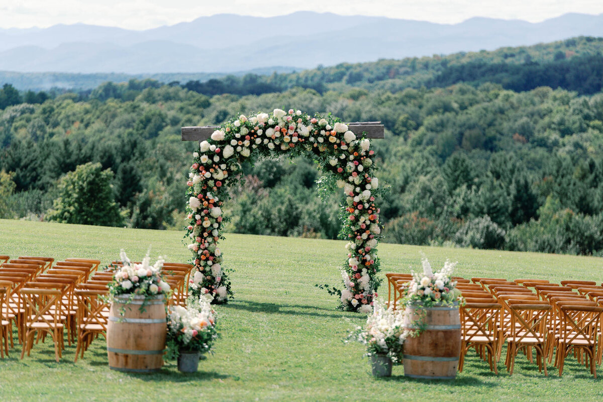 large floral arch at maquam barn and winery with epic view