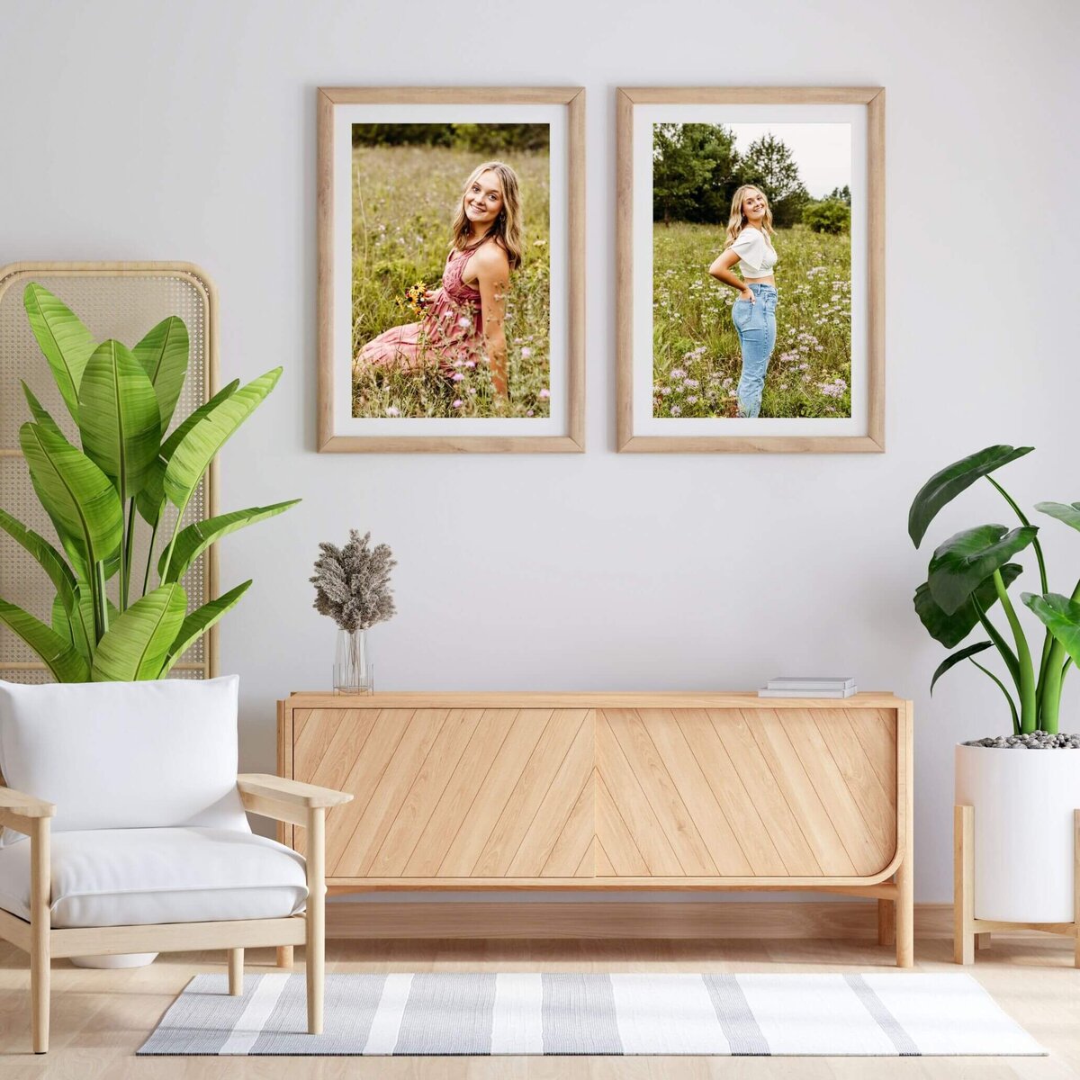 sitting area decorated with a white chair, beautiful plants, a wooden buffet and two gorgeous framed senior photos