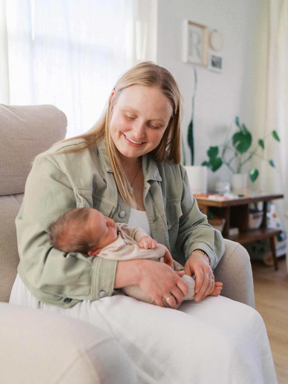 mom-smiling-at-new-baby