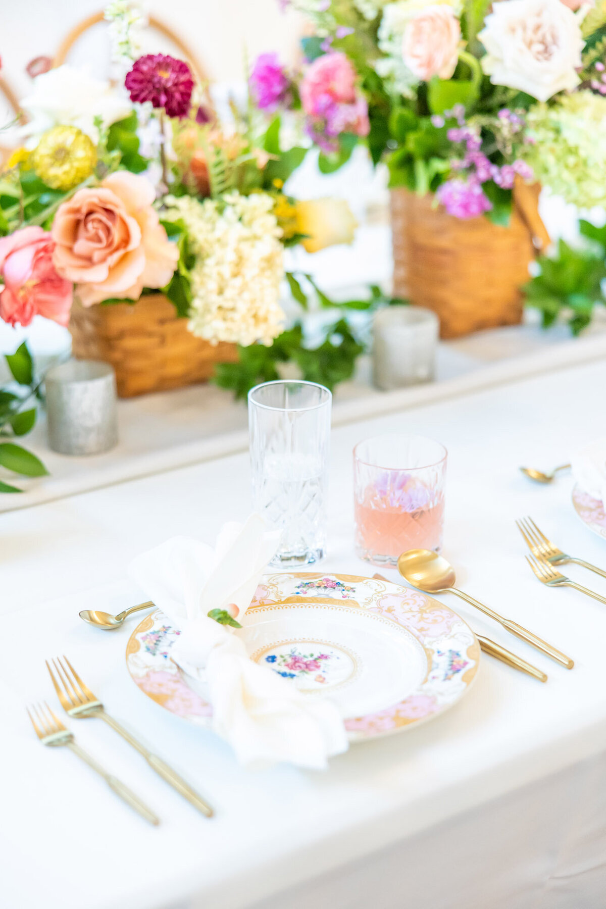 Bright, floral tablescape for wedding reception