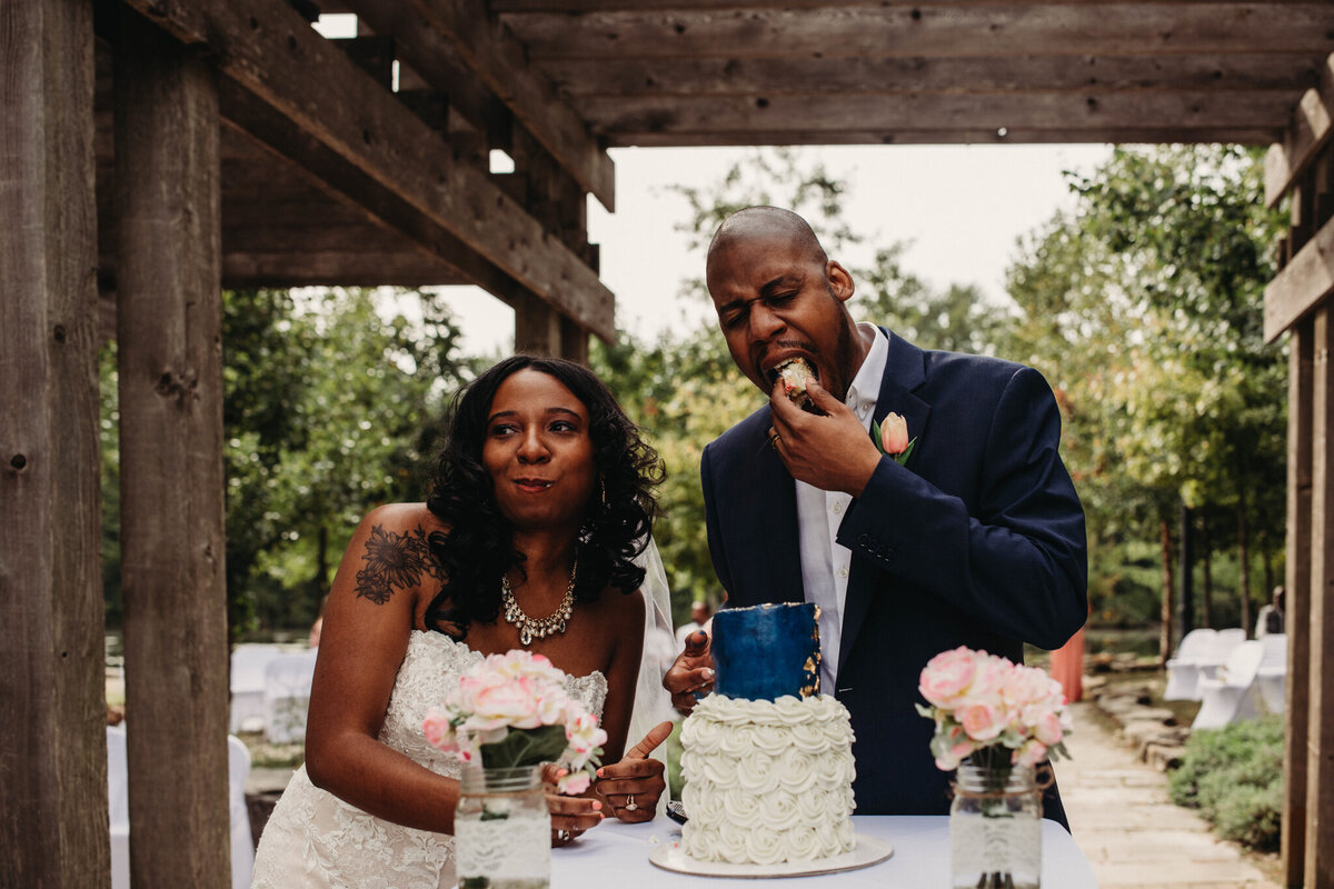 Bride and Groom cut the cake at their lakeside ceremony.