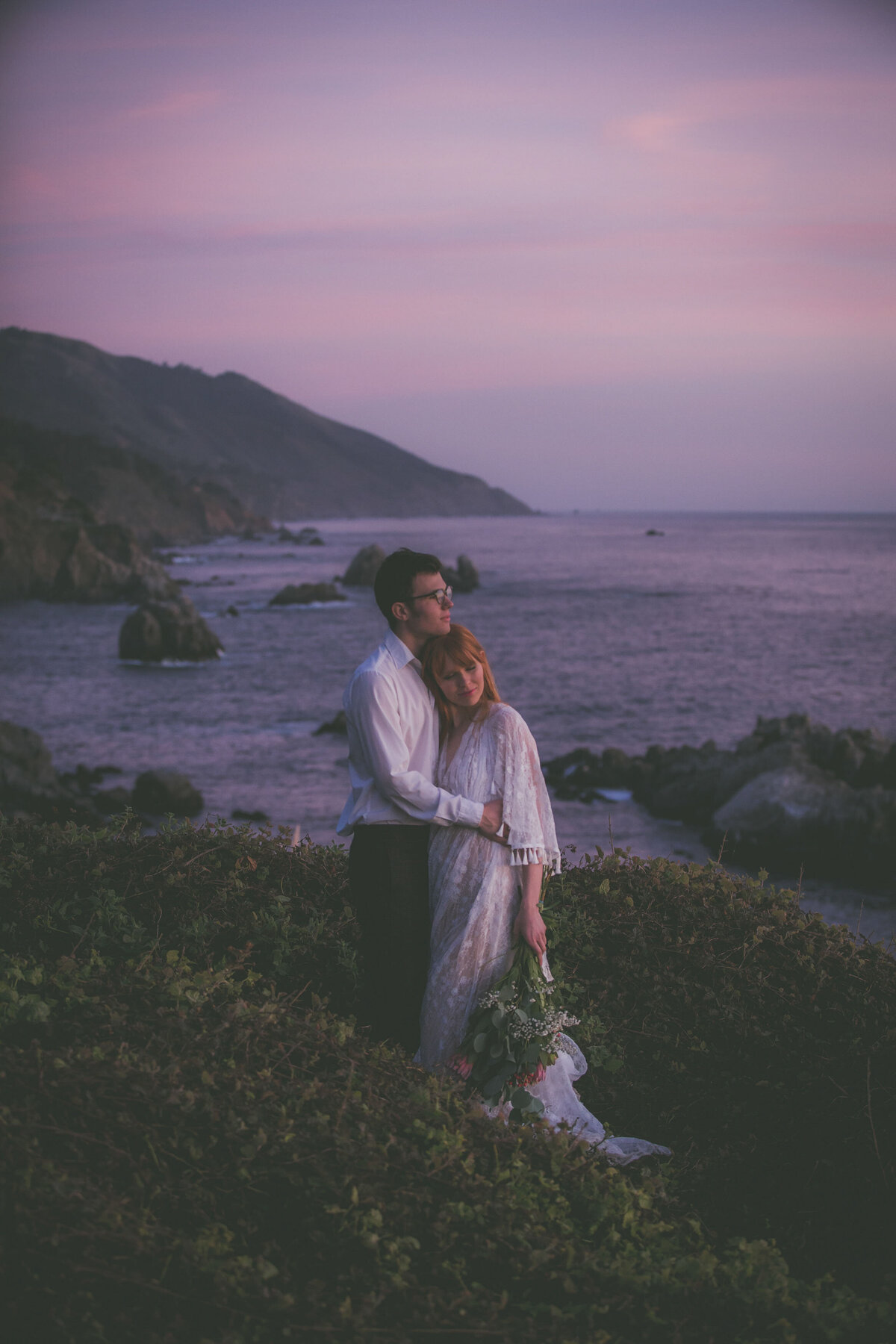 Couple enjoys sunset during Big Sur elopement.