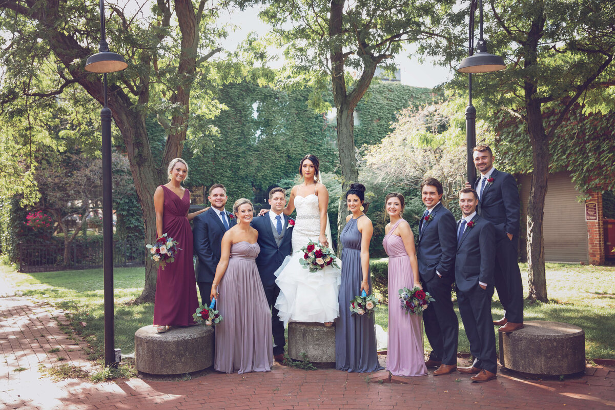 Photo of wedding party posed in the modern tool square courtyard in downtown Erie Pa