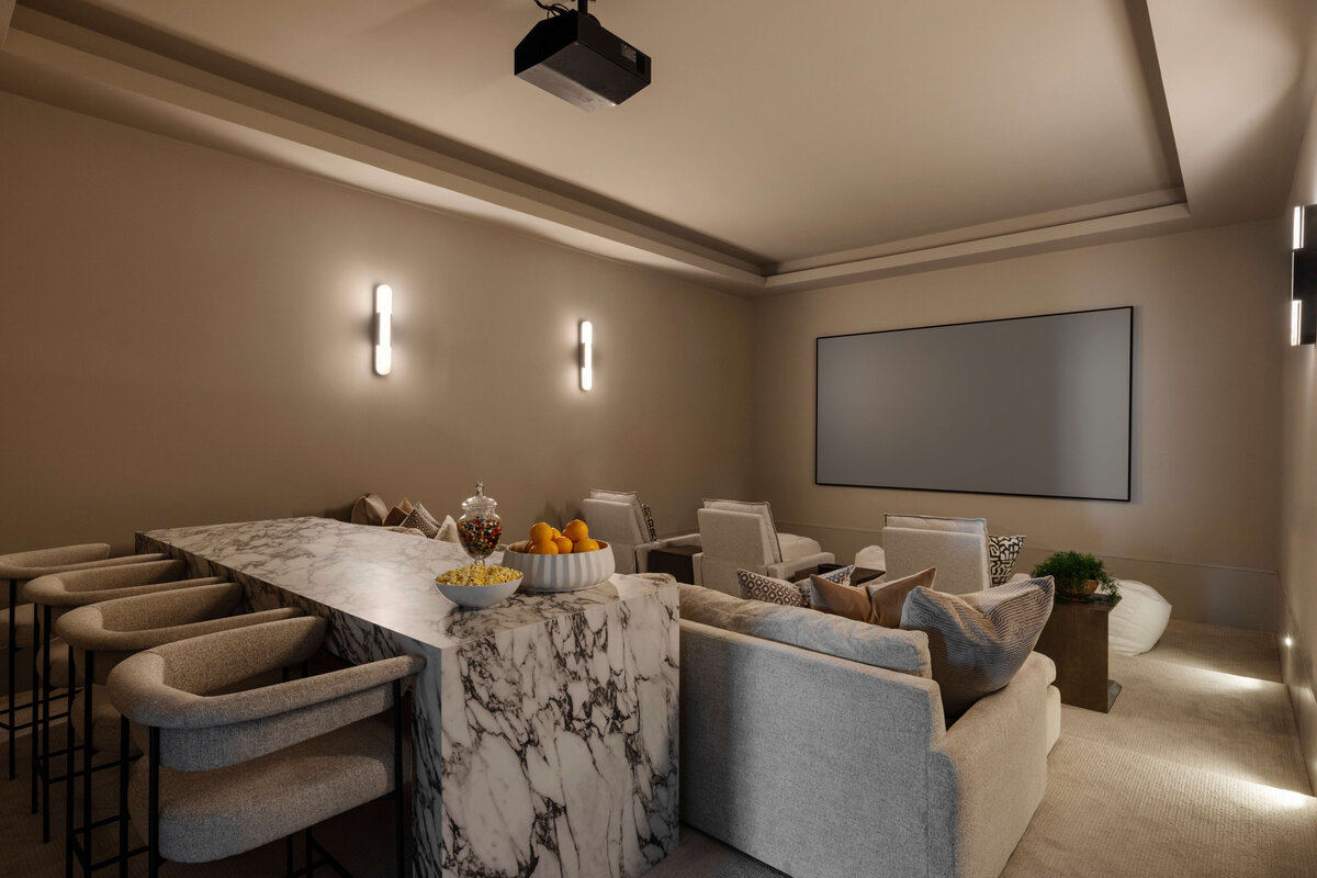 oyster creek studios hughes theatre area with marble table and tan seating