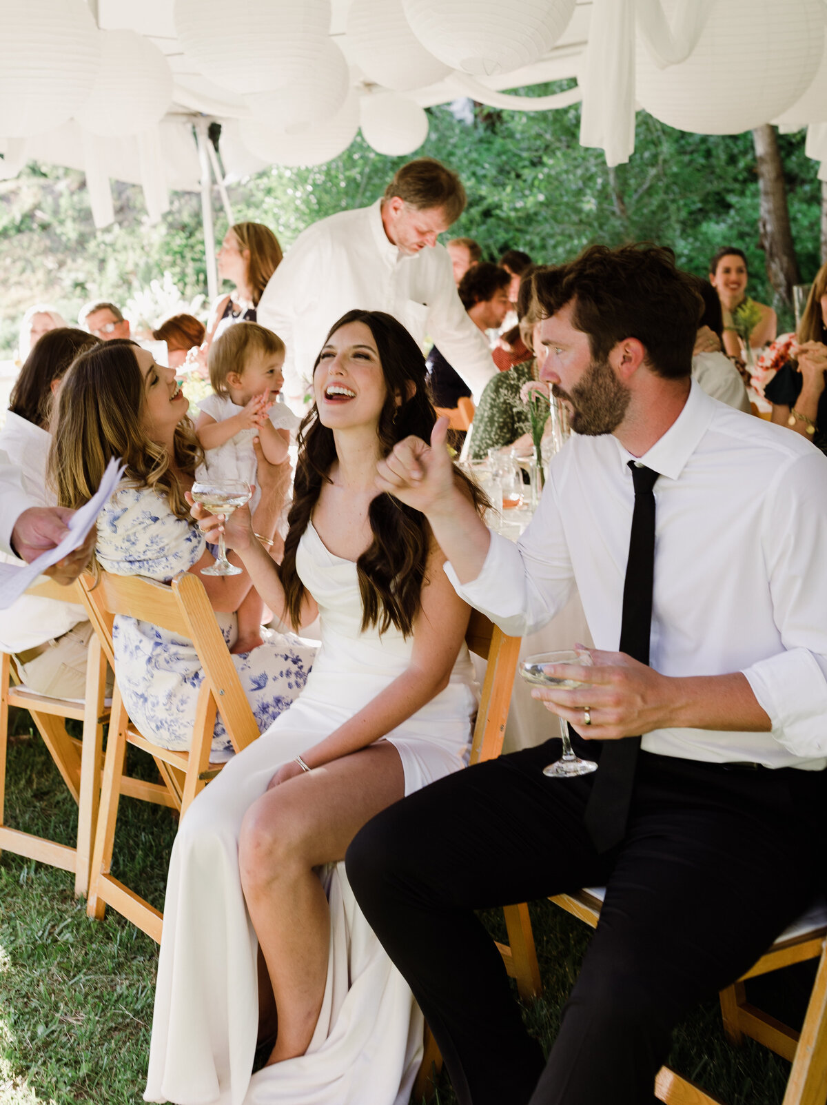 Bride and grooms reaction to wedding speech at Dallenbach Ranch Wedding reception Colorado
