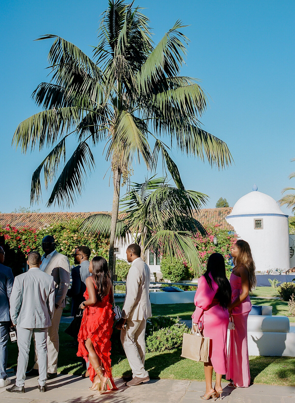 Best dressed African wedding guests in Lisbon Portugal . Colorful film photo by best African photographer Mo Davis
