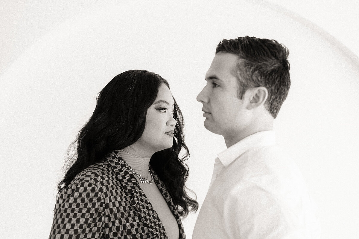 Two people look towards each other