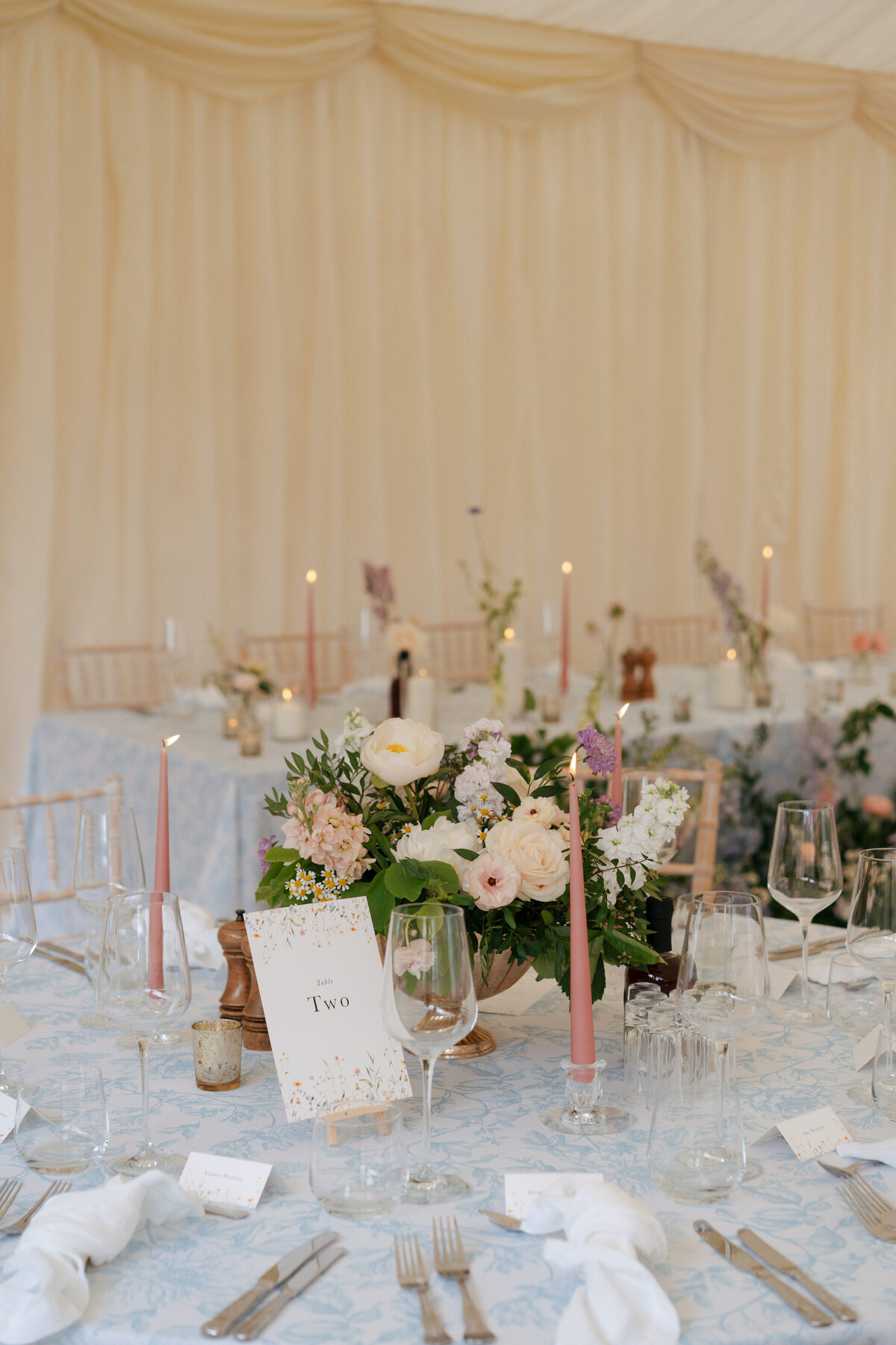 floral tablecloth marquee wedding with flowers