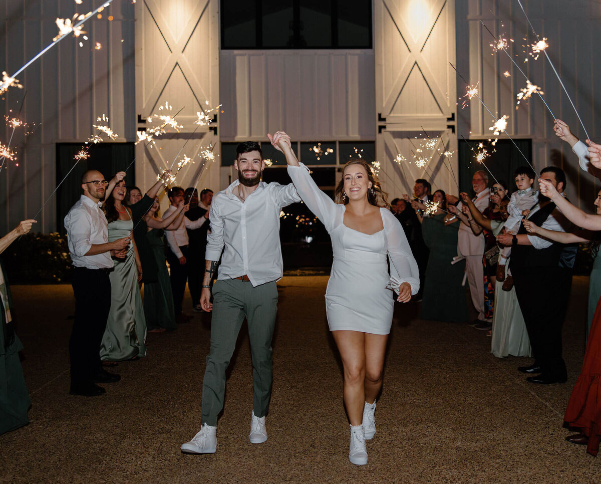 bride and groom during wedding day sparkler exit