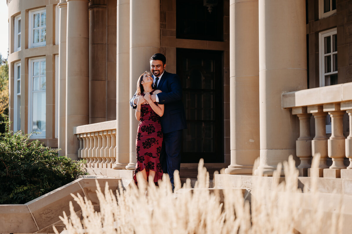 Man hugs his fiance in front of the Government House in Edmonton, Alberta