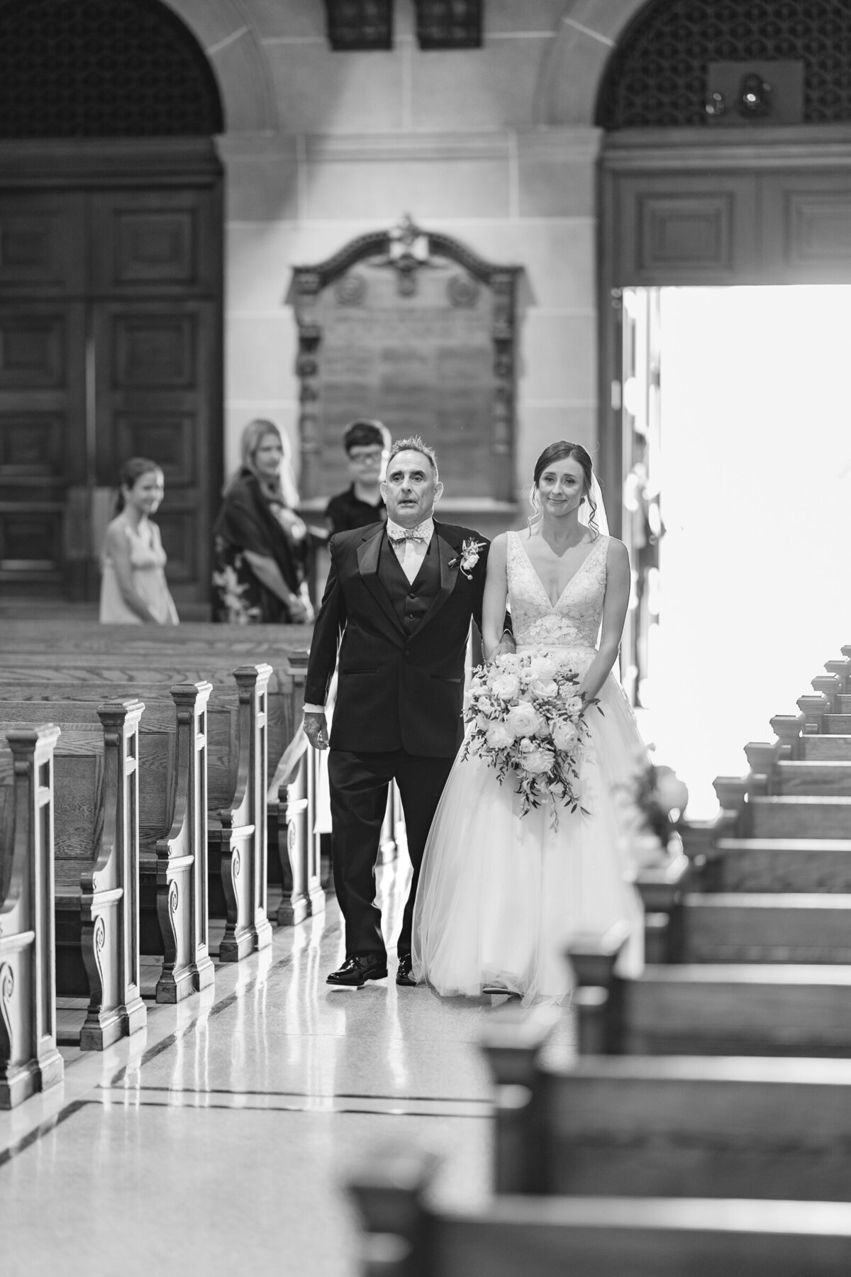 Father of the bride walking his daughter down the isle.