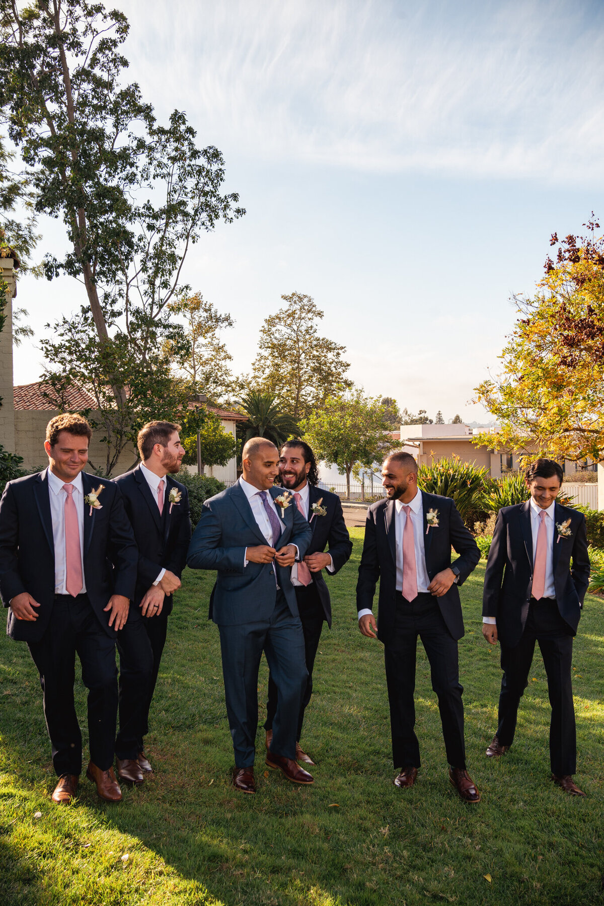 Groomsmen walk with the groom