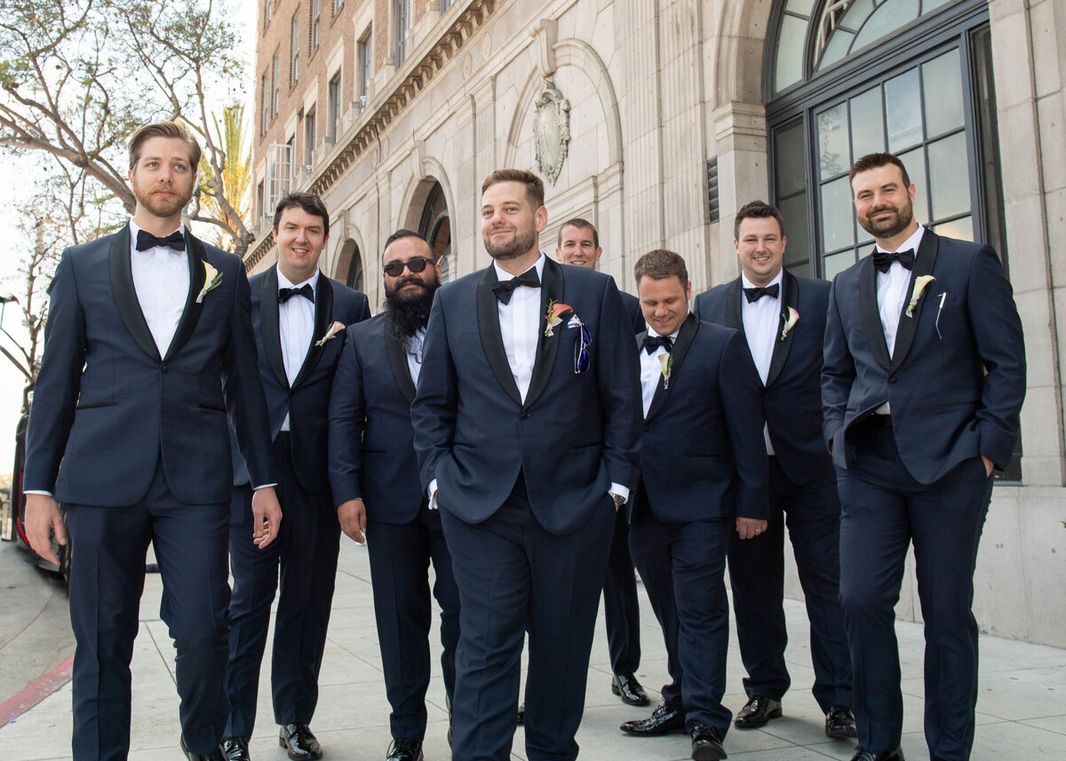 groomsman waling outside the Culver hotel