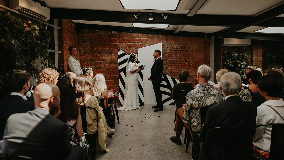 Wide shot of a monochrome wedding ceremony at The Shack Revolution.