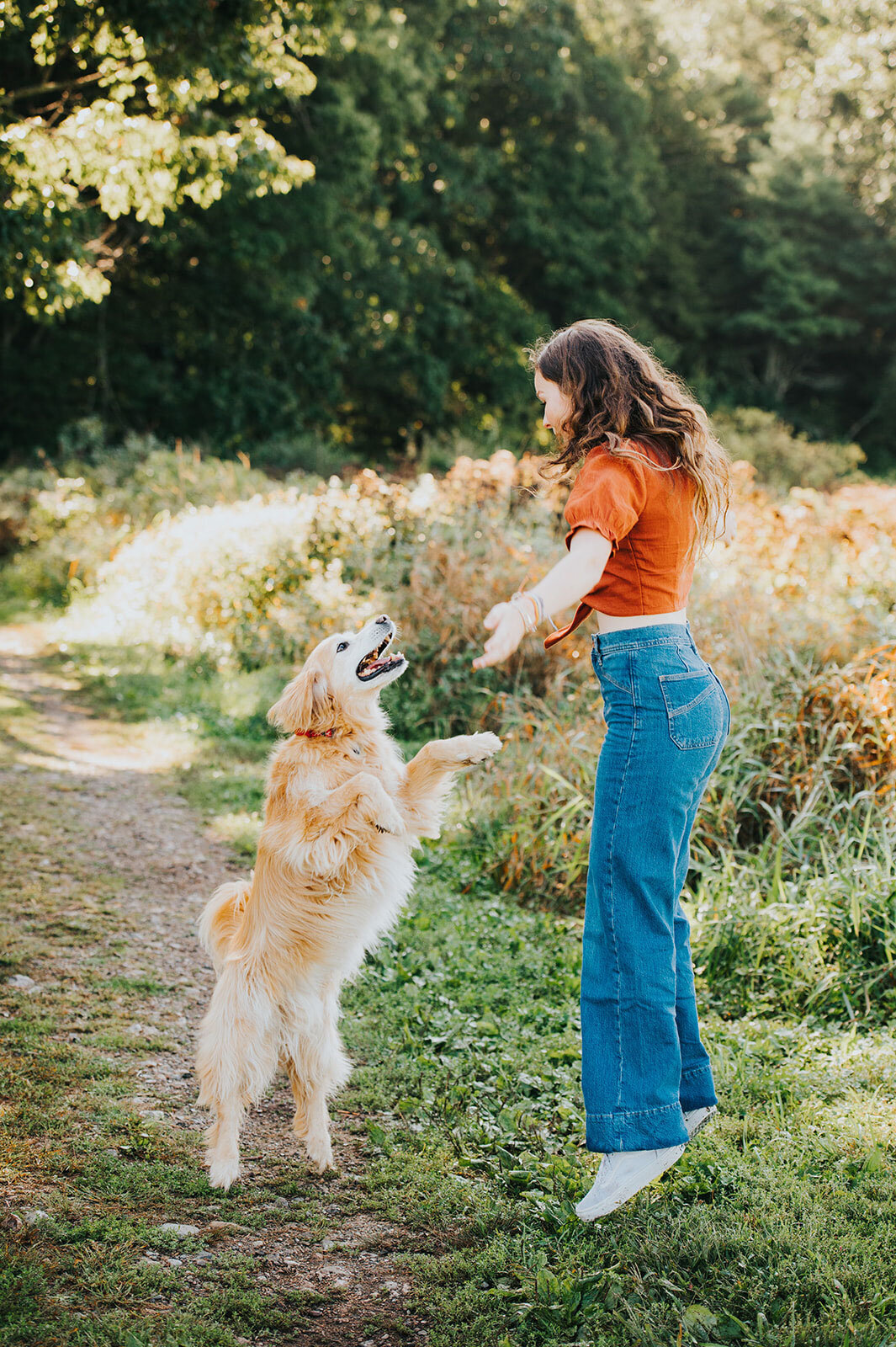 senior portrait with golden retriever dog in field vermont