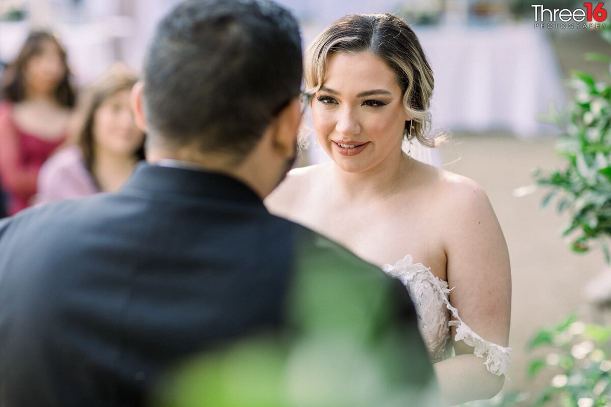 Bride looks at her Groom during ceremony